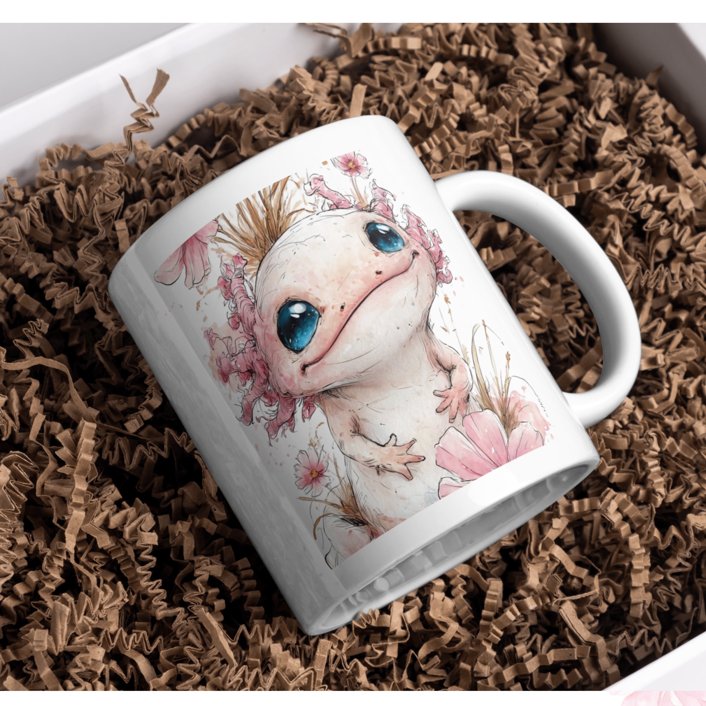 White mug with axolotl design on brown crinkled paper